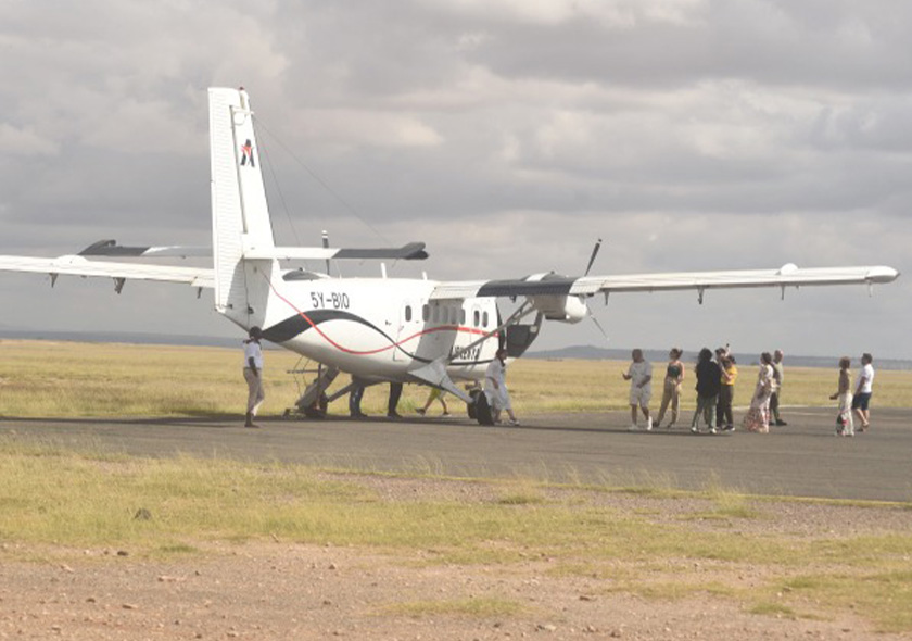 Light aircraft landing at Amboseli airstrip for luxury fly-in safari